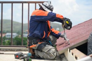 roofers repairing roof