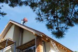 man working on a roof
