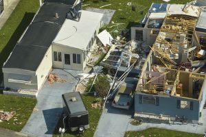 Destroyed by hurricane Ian suburban houses in Florida mobile home residential area. Consequences of natural disaster.