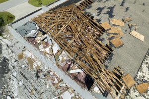 Damaged house roof and walls 
