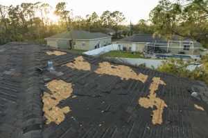house roof with missing shingles 