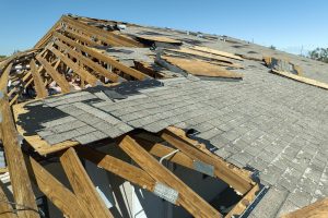 Natural disaster destroyed house roof 