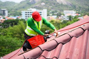 Inspector assessing roof after storm.